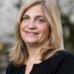 women smiling in black dress