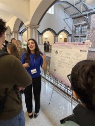 Person presenting research poster on caregiver interactions at University of Washington event