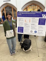 Person standing next to a research poster at the University of Washington