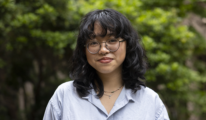 Professional headshot of a person smiling outdoors
